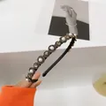 Cerchietto barocco con perle e dischi di strass bronzo su una base in metallo nero - Filigrana di Perle Vintage