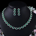 Elegantes Set aus Halskette und Ohrringen mit ovalen grünen Zirkonia auf schwarzem Büstenhalter - Grün