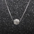 Macro shot of silver ball necklace with intricate filigree details and micro-set cubic zirconia - 1 Ball / Silver