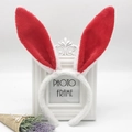 Detail of cute plush bunny ears headband with red sequins and white fluffy texture - White and Red Rabbit