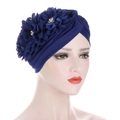 Detail of navy blue turban hat with 3D fabric flowers, pearls, and rhinestones - Royal Blue