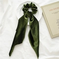 Elegant green velvet scrunchie with long ribbon scarf displayed on a decorative plate - Army Green Velvet Streamer