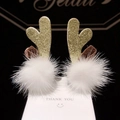 Christmas hair clips with golden sequin antlers and white plush balls on display card - 29 Gold Antler with Short Ears and Pom Pom Pair