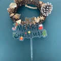 Acrylic Merry Christmas cake topper with reindeer and festive motifs on green background - Clear Base Style A