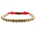 Close-up of red braided rope bracelet with 4mm gold beads and sparkling crystal charms - Single Item / Gold