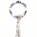 Macro detail of snake skin pattern wristlet keychain with gold ring and leather tassel - Silver-White Snake