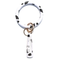 Modieuze koeienprint PU leer cirkel sleutelhanger met kwast armband, stijlvol accessoire voor tas. - Koeprint