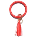 Close-up of red lychee pattern leather keyring with round bangle and tassel detail - Red