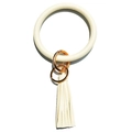 Detail of off-white lychee texture leather bangle keychain with tassel and gold hardware - Off White