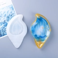 Macro detail of seashell silicone mold with blue and gold resin art finish - Conch Dish Silicone Mold