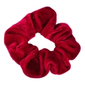 Close-up detail of a soft red velvet hair scrunchie, showing smooth texture and elastic. - Red Triangle