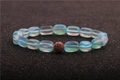 Macro shot of moonstone bead bracelet with a zircon-encrusted copper sphere charm - Light Blue Aurora With Copper Ball Style (12)