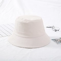 Minimalist beige cotton bucket hat with reinforced brim stitching for sun protection - Beige