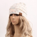 Chunky knit beanie in cream white with colorful confetti dots and a faux leather logo - White