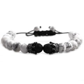Detailed view of 8mm white turquoise and black volcanic lava beads with crown charms - Single Braided Pull Rope / Howlite Lava Gun Black Crown