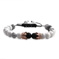 Detail of white howlite beads and lava stones with rose gold crown on braided bracelet - Single Braided Pull Rope / Howlite Lava Rose Gold Crown