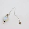 Macro shot of 18mm opal stone pendulum pendant with silver hollow bead and chain - Opal
