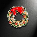 Christmas wreath brooch with green enamel leaves, red bow, and sparkling crystals - Christmas Wreath Style (YNCP4754)