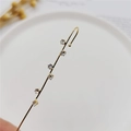 Elegant gold linear ear crawler featuring six sparkling white cubic zirconia stones - Six Zircon Gold