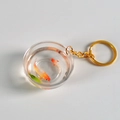 Portachiavi creativo a boccia con pesci rossi in resina e anello in metallo dorato - Diametro 4,2 cm/Portachiavi Dorato / Koi Multicolore (N. 5)