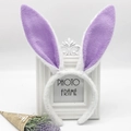 Close-up of white plush bunny ears headband with purple sequin inner on a vintage frame - White and Purple Rabbit