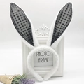 Detail showing white plush rabbit ears headband with black polka dot mesh on white frame - Black Sequin Bunny