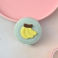 Mini round portable retractable measuring tape with a mint green shell and banana design - Banana
