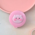 Pink Nordic-style mini tape measure featuring a cute round pig face character design - Pig