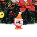 Wind-up Santa Claus toy in orange hat and red suit with a festive holiday background - Wind-up Pointy Hat Santa Orange