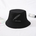 Classic black cotton bucket hat featuring white feather embroidery and slogan detail - Black Feather Embroidery