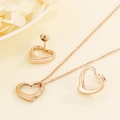 Set di collana e orecchini a cuore traforato in acciaio inossidabile finitura oro rosa - Oro rosa