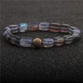 Elegant moonlight stone bead bracelet with a gold pavé crystal charm on a dark background - Grey Frosted Aurora Style (14)