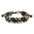 Macro detail of double-layer woven bracelet with tiger eye beads and engraved Om symbol - With Om Symbol Metal Accessory / Hematite + Black Obsidian + Tiger Eye
