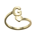 Close-up of golden letter G and heart design on adjustable stainless steel ring - Letter G / Gold