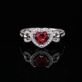 Elegant silver ring with a red heart-shaped zircon and pave diamonds on a black background - Red / US 7