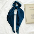 Dark blue velvet scrunchie with long ribbon tails on white fabric background - Navy Blue Velvet Streamer