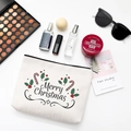 Off-white canvas Merry Christmas cosmetic bag with accessories on white background - Style E