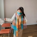 Close-up of vibrant rainbow plaid scarf showing soft texture and thick braided tassels - No.7 Lake Blue Orange Plaid