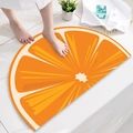 Semi-circular orange slice bath mat with non-slip texture for bathroom and entryway - Orange