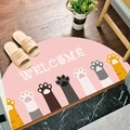 Semi-circular pink cat paw welcome mat with absorbent non-slip texture for entryways - Cat Paws Welcome
