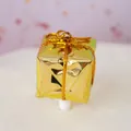 Miniature gold gift box cake topper with metallic finish and decorative golden string - Gold Gift Box