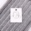 White earring display card with abstract face line art on a grey velvet surface - 4.8x6.2CM