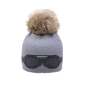 Detailed close-up of grey knit beanie with large faux fur pom and decorative goggles - Adult Style (Star Goggle Style) / Light Gray - Imitation Raccoon Fur Ball