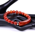 Red agate beaded bracelet with long curved tube bead and silver spacer on hand model - Natural Banded Red Agate (SL245A06)