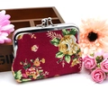 Close-up of vintage floral canvas coin purse with roses and silver metal clasp closure - Rose Red