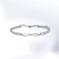 Silbernes Mobius-Webarmband mit einem Unendlichkeitssymbol und feinen Diamanten - 925er Silber / Damenstil