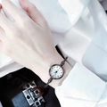 Close-up of minimalist women quartz watch with white dial and black Arabic numerals - Arabic Numerals Black Band White Dial