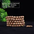 Macro shot of 108 polished Vietnam agarwood beads with natural grain and dark brown texture - Plain Style / 8mm*108 Beads