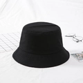 Minimalist black cotton canvas bucket hat for sun protection in a flat lay setup - Black