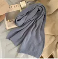 Detail of light blue chunky ribbed knit scarf with soft texture and warm fabric - Haze Blue